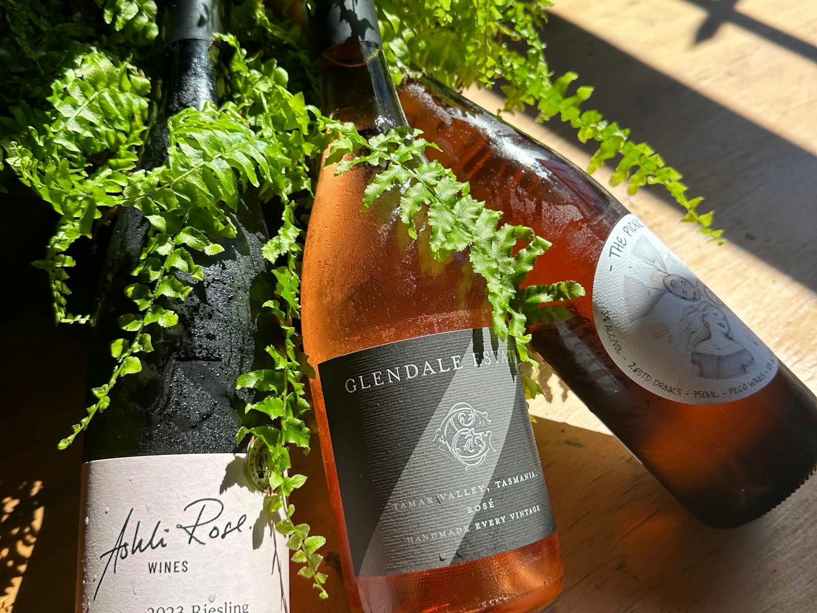 This photo is three bottles of award winning local wines