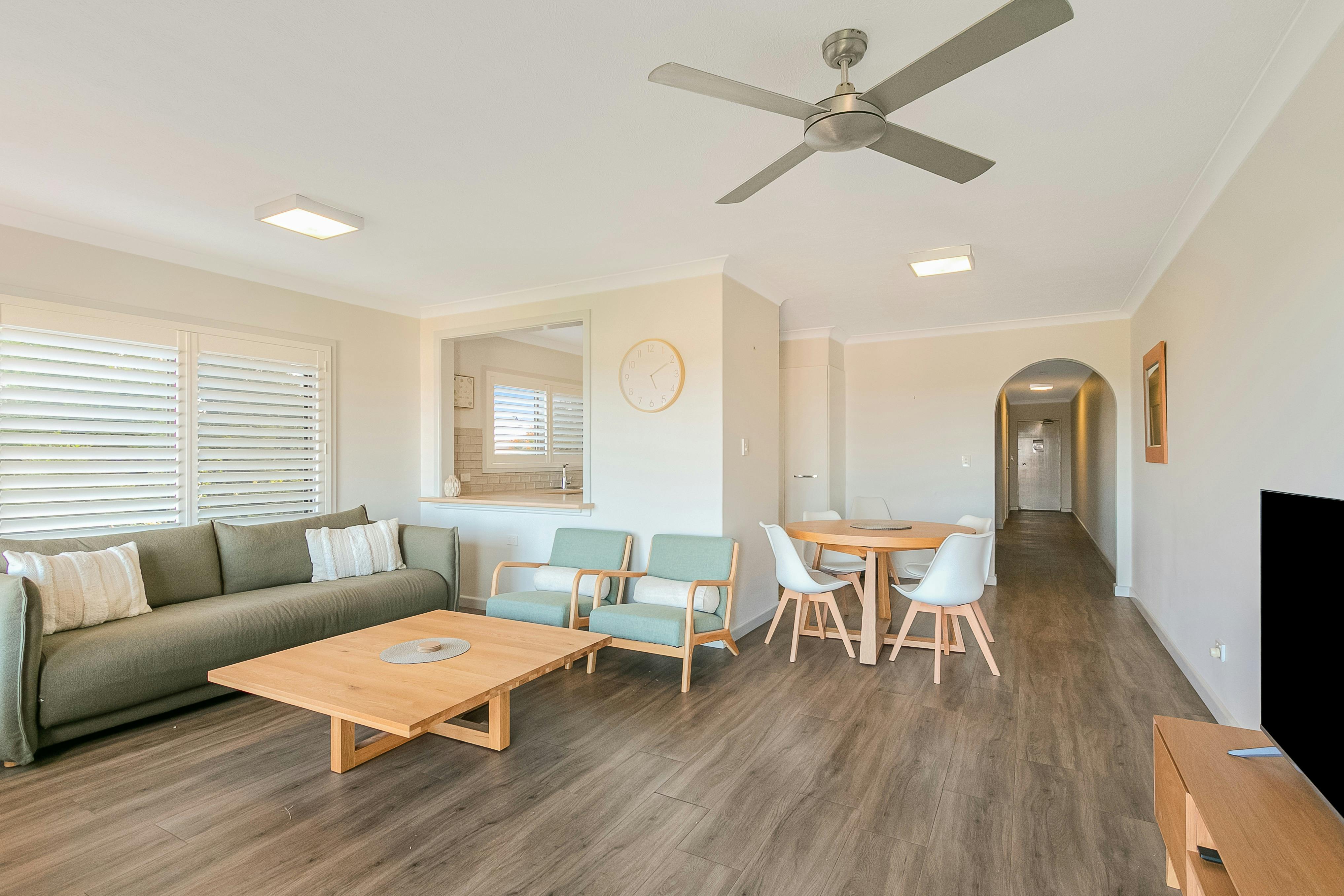 Open plan, living area with smart TV and ceiling fan