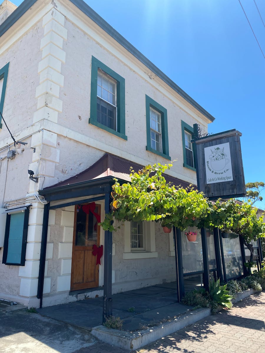 front of Bloom & Brew Co Building, showing front veranda