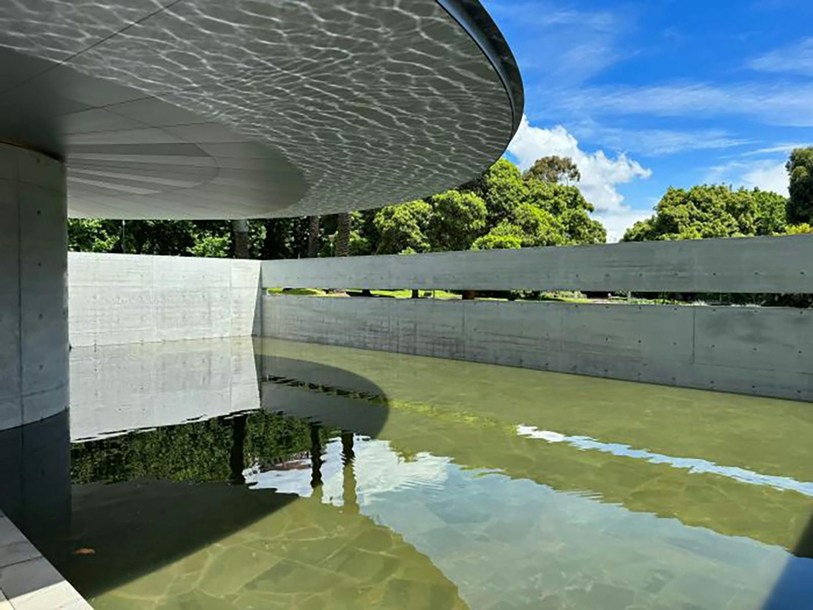 A modern building with a water feature