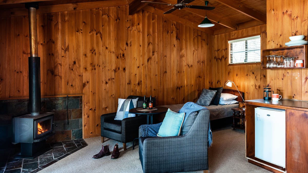 Enjoy the log fire in our Timber Cabin