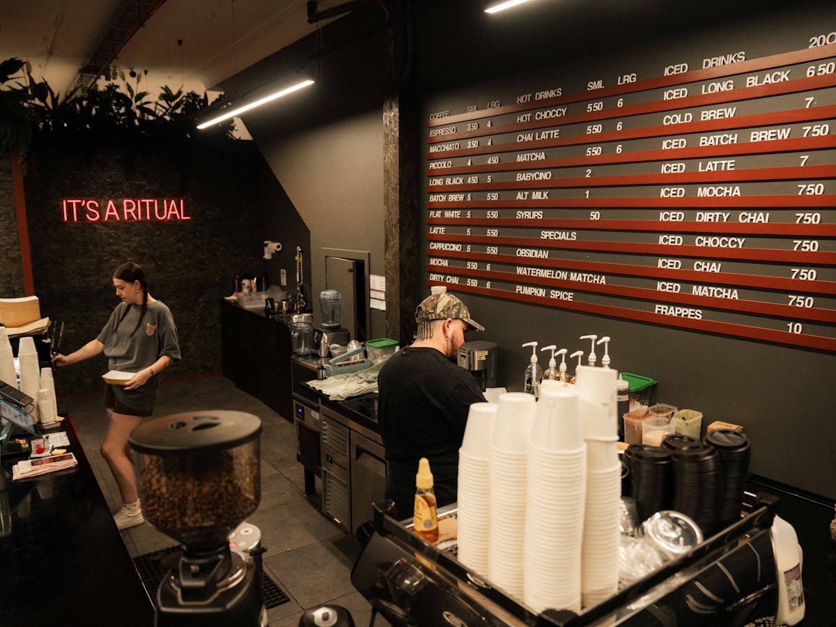 A more expanded version of the menu board, the service area, where the POS is and coffee machine are