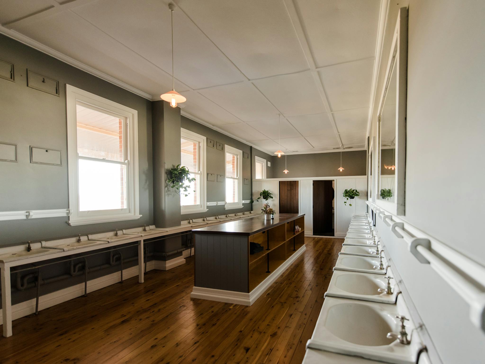 Original boardinghouse bathroom with two lockable shower/toilet areas