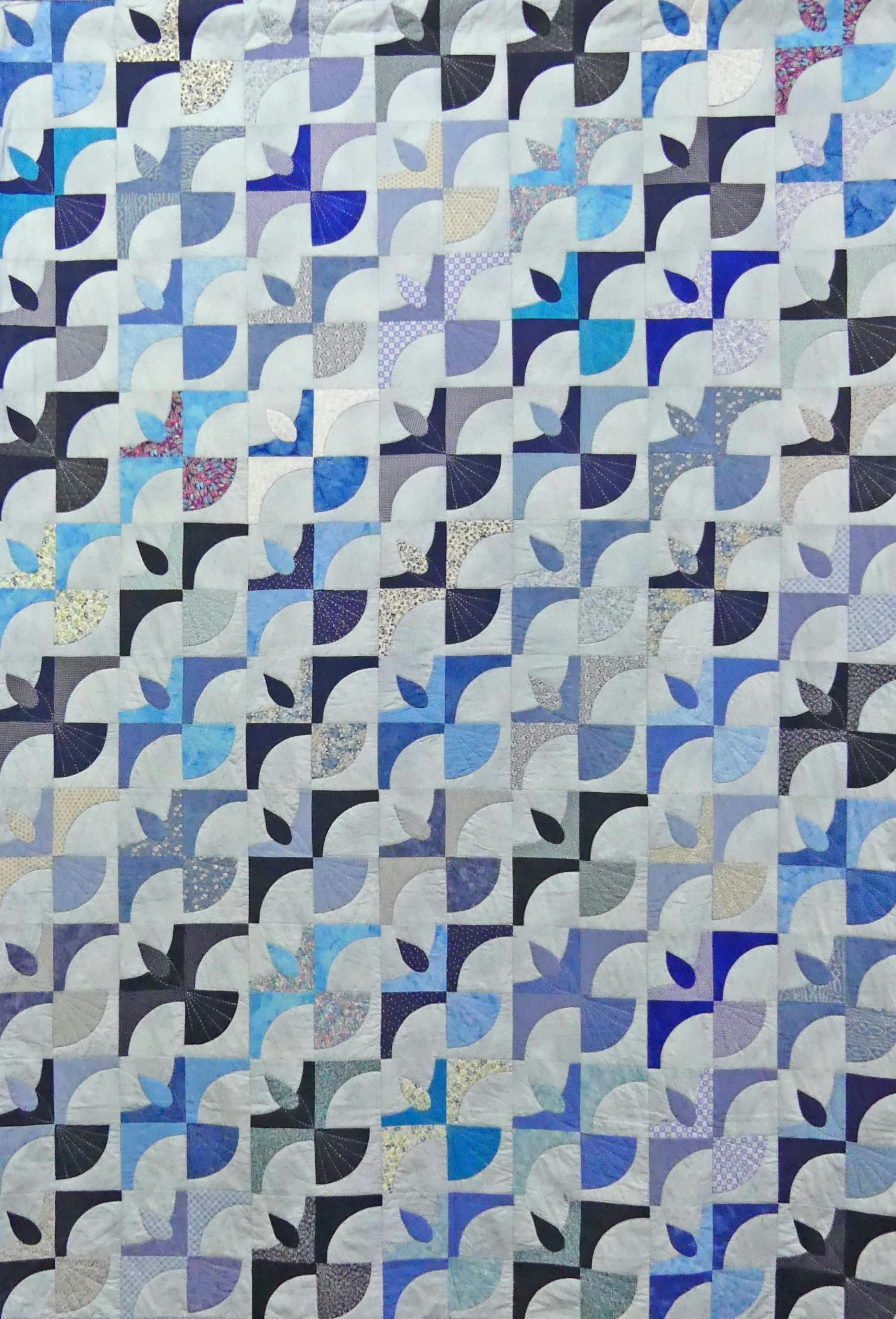 Stylised birds in colours of blue, grey and navy.