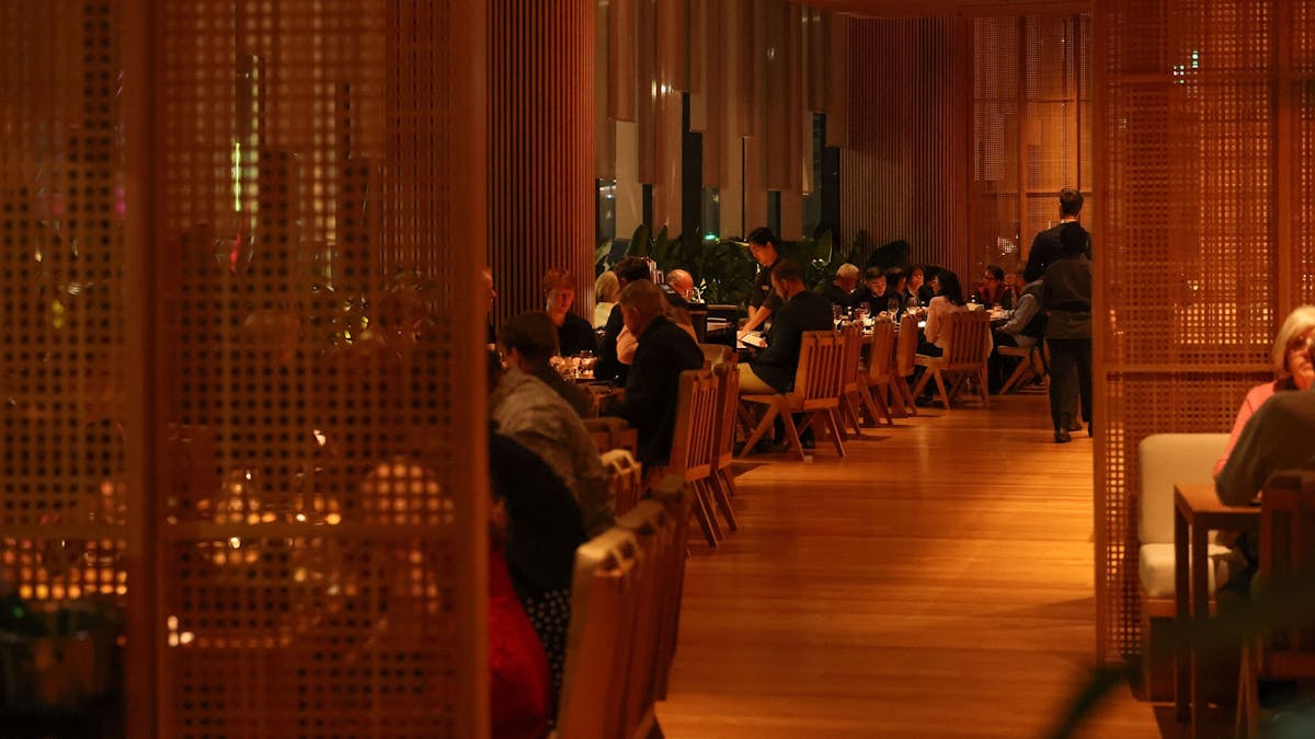 Tables in a moody restaurant setting