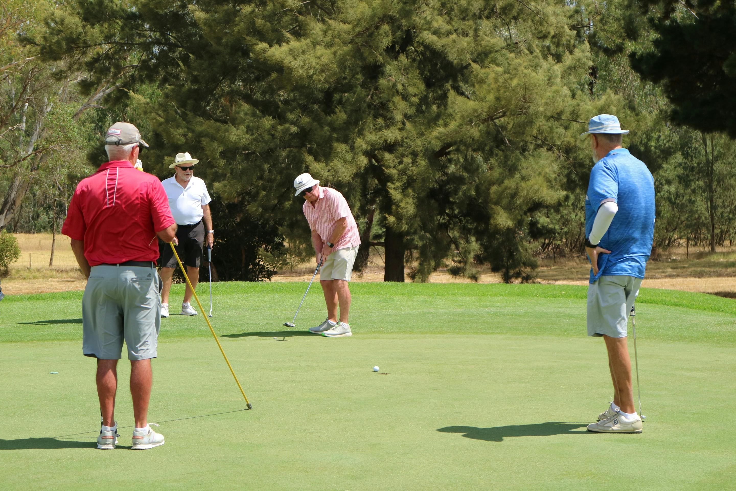 men on putting green