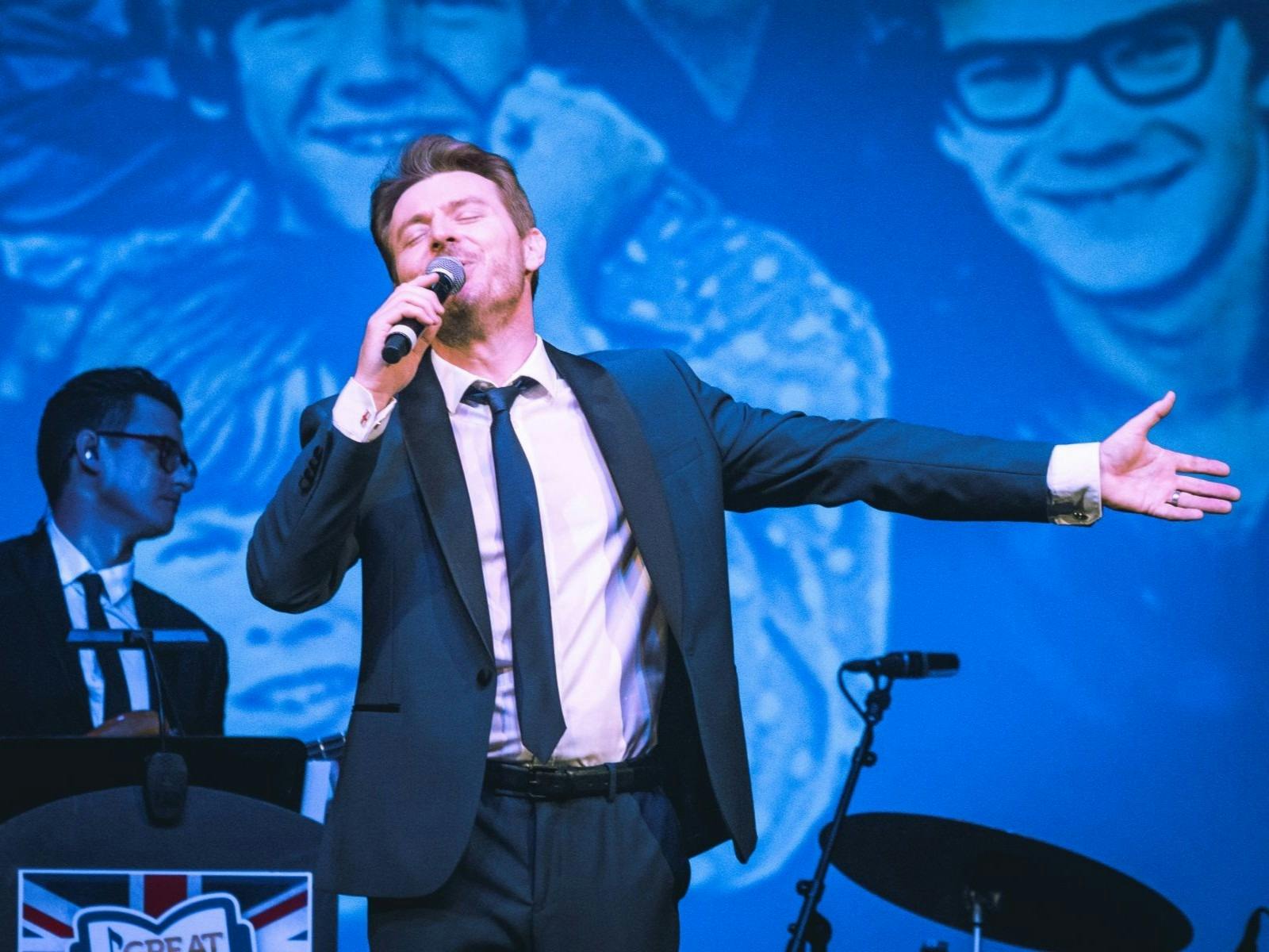 Man singing on stage