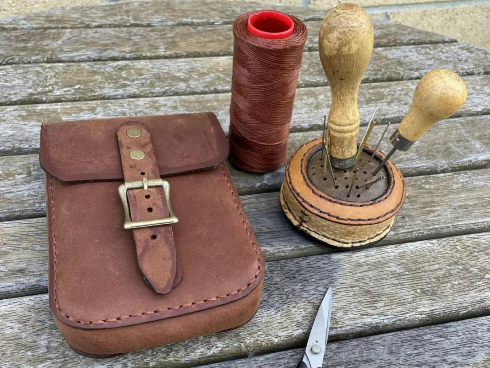 Leather buckled pouch with utensils