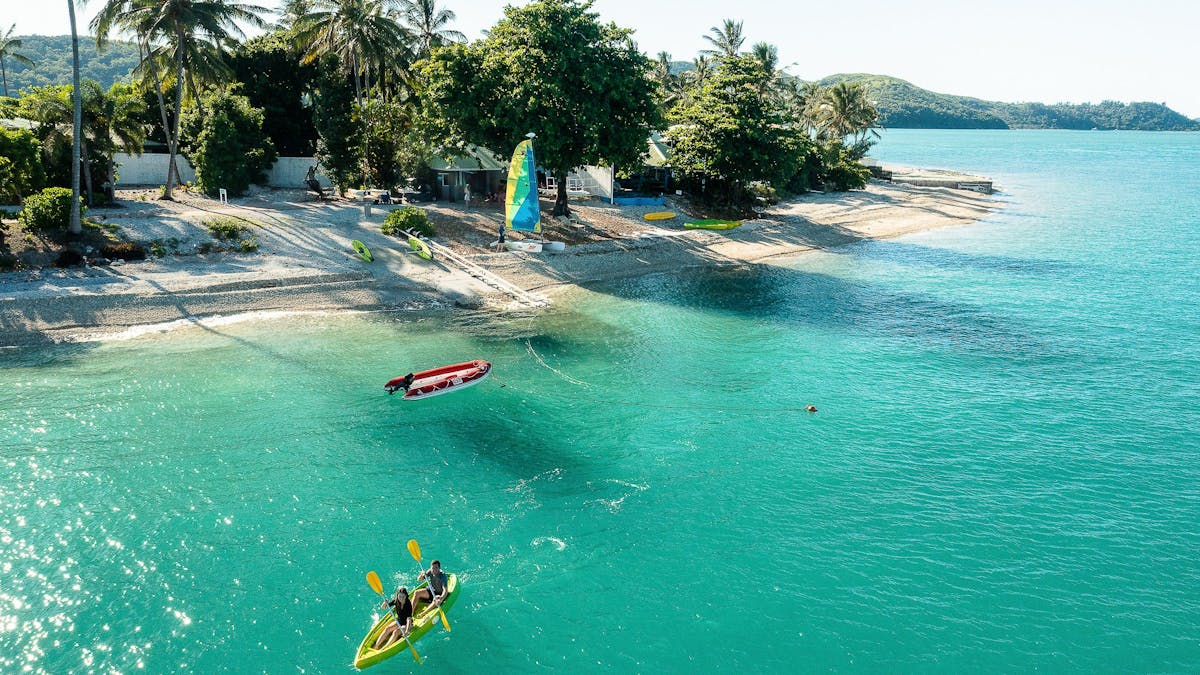 Two people kayaking off Daydream Island.