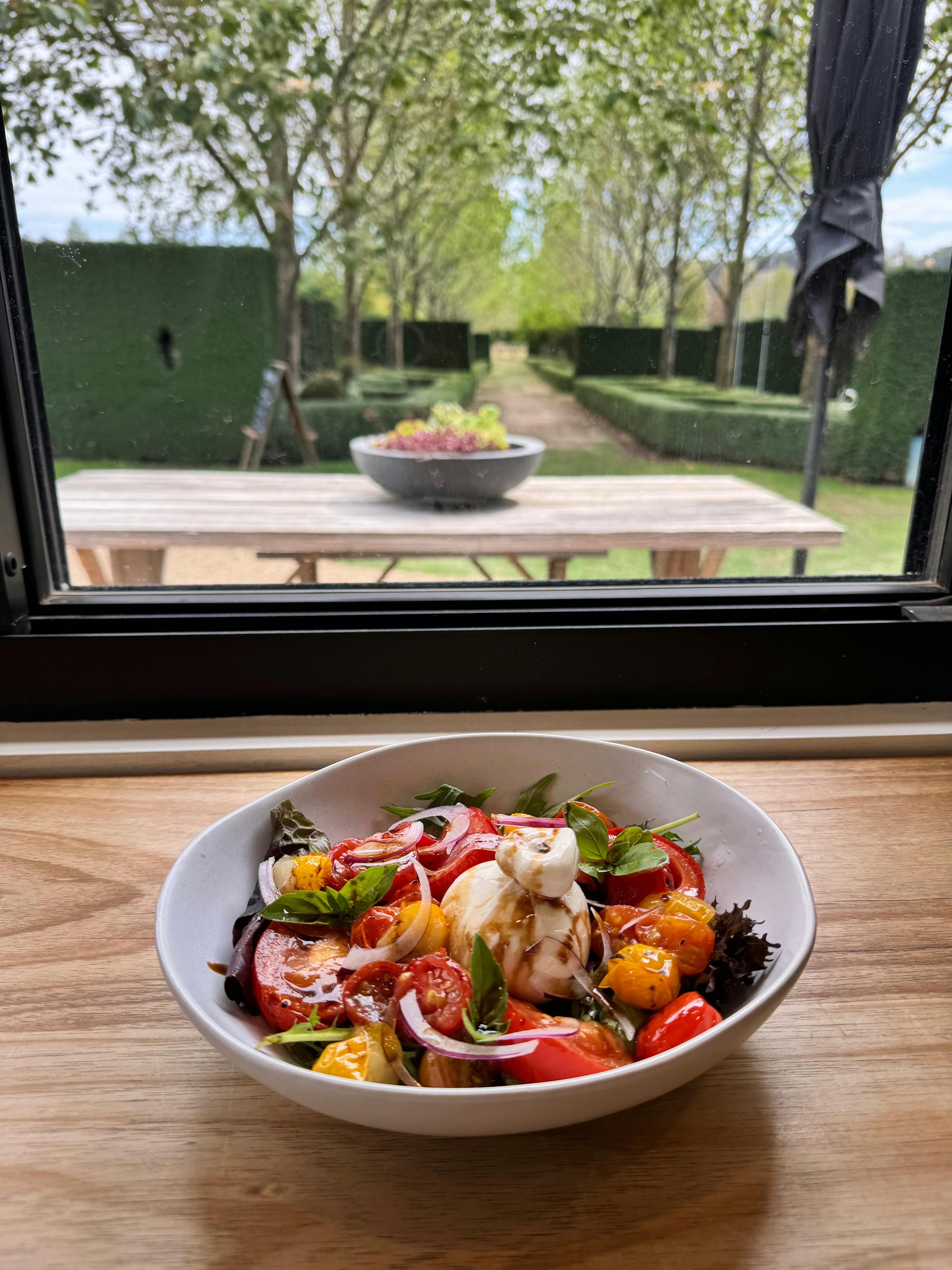 Medley cherry tomatoes, burrata cheese, balsamic reduction & Basil