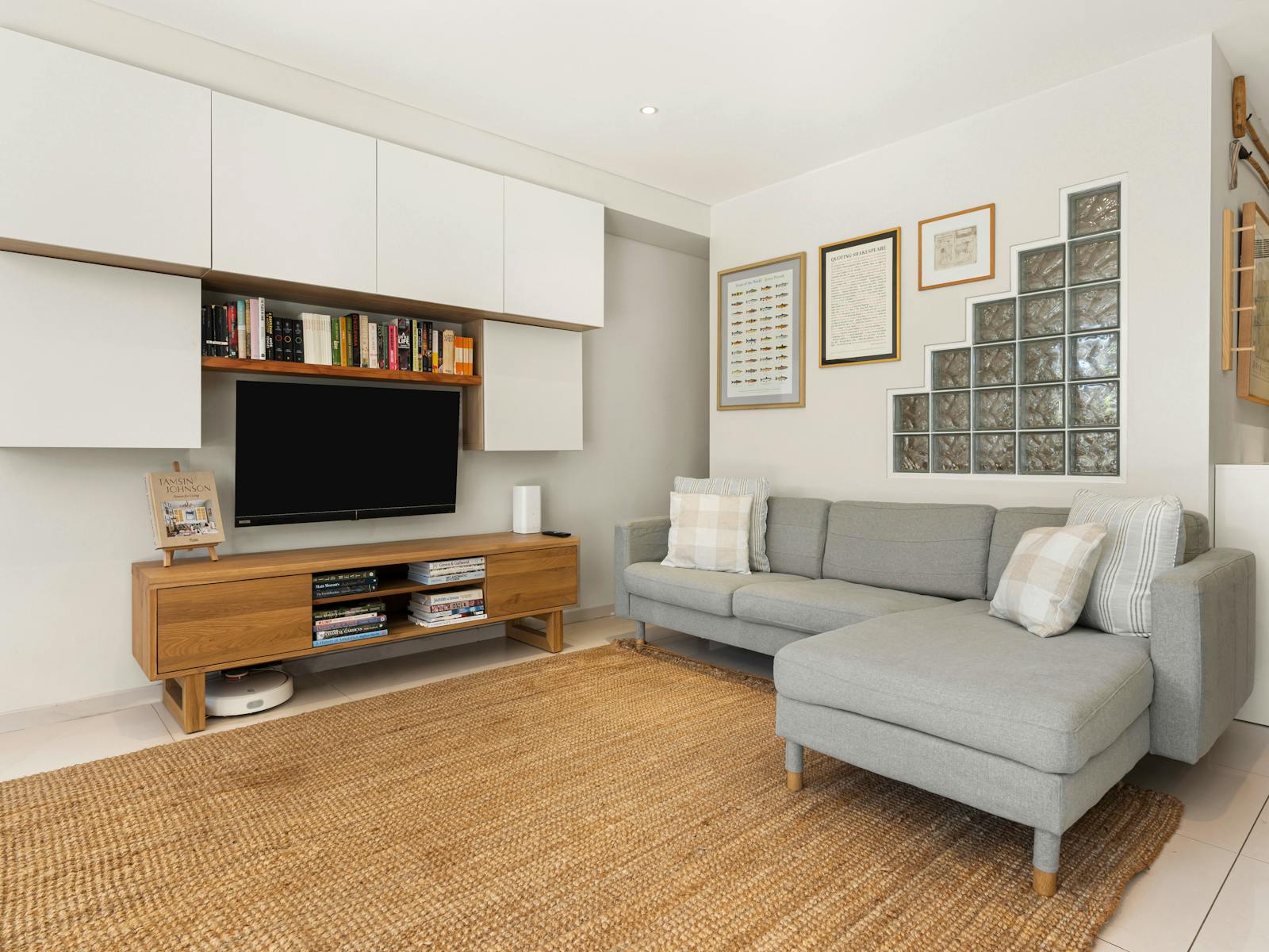 Modern kitchen and living space with a turquoise splashback and a cozy private courtyard.