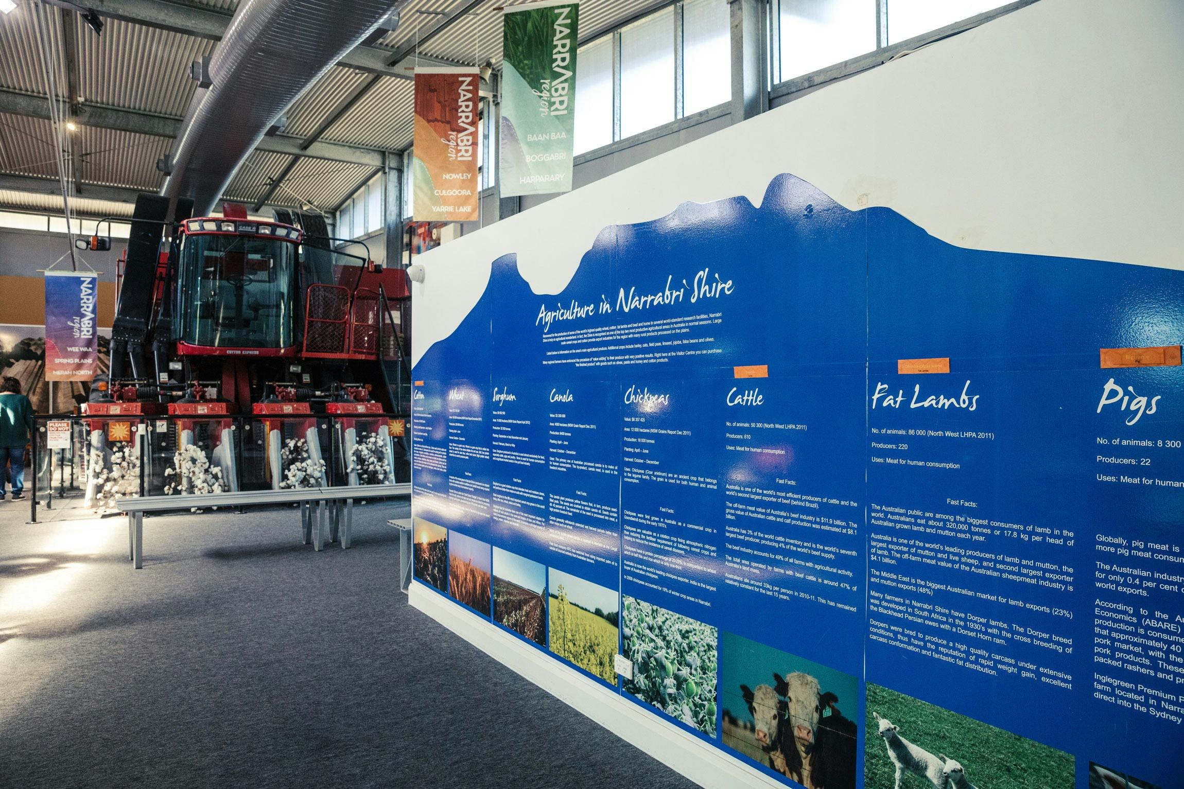 Inside of Narrabri Region Visitor Information Centre showcasing red cotton picker