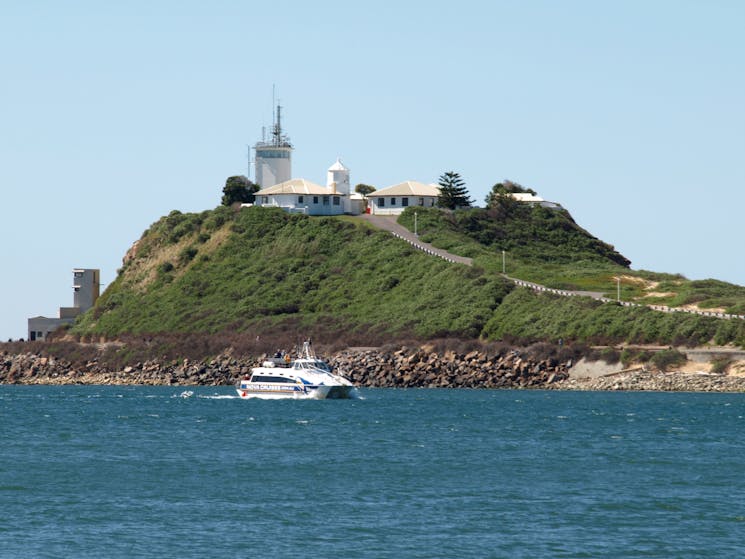 Vessel 'Bay Connections' in foreground with Nobbies headland in background