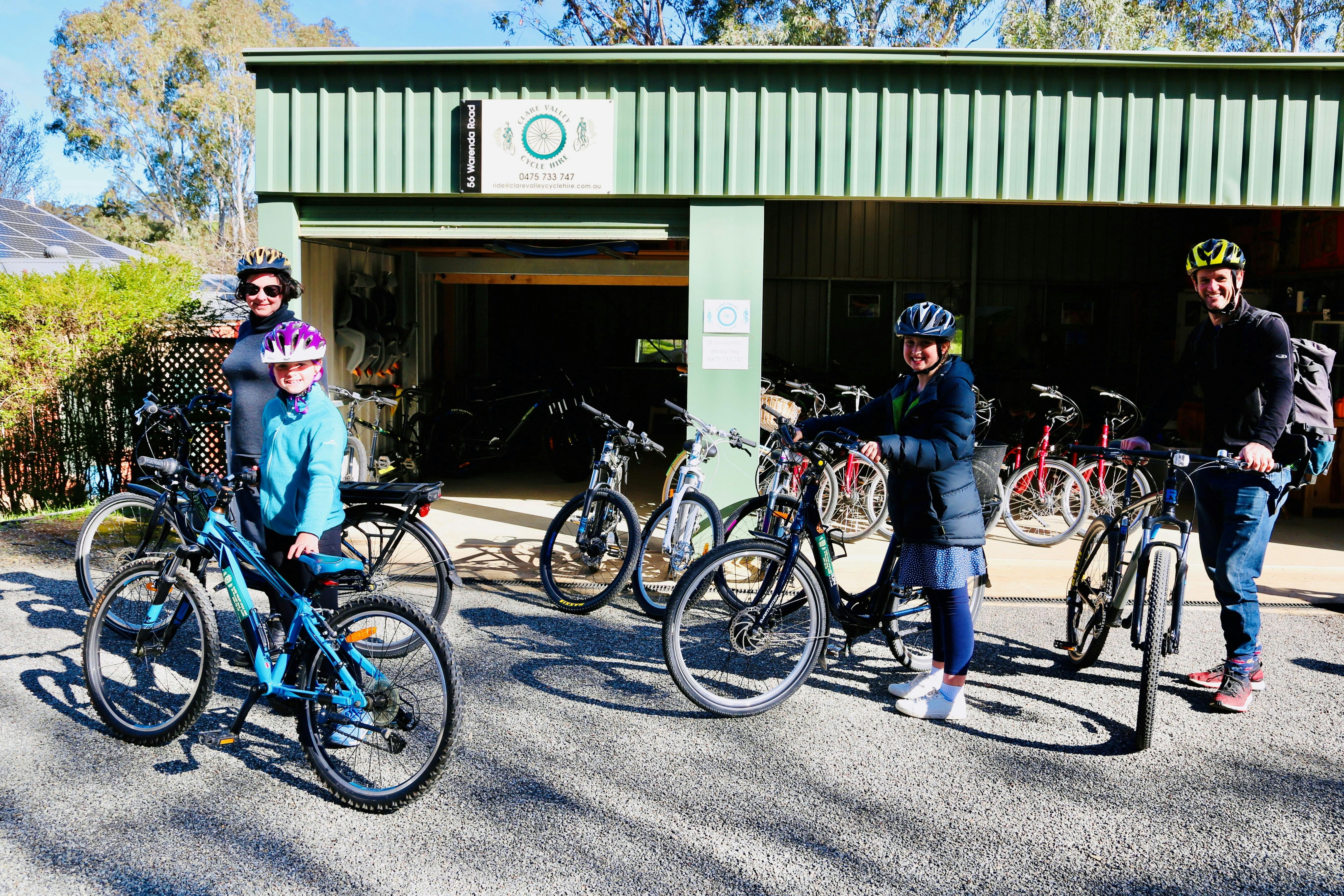 Family group in front of our bike shed