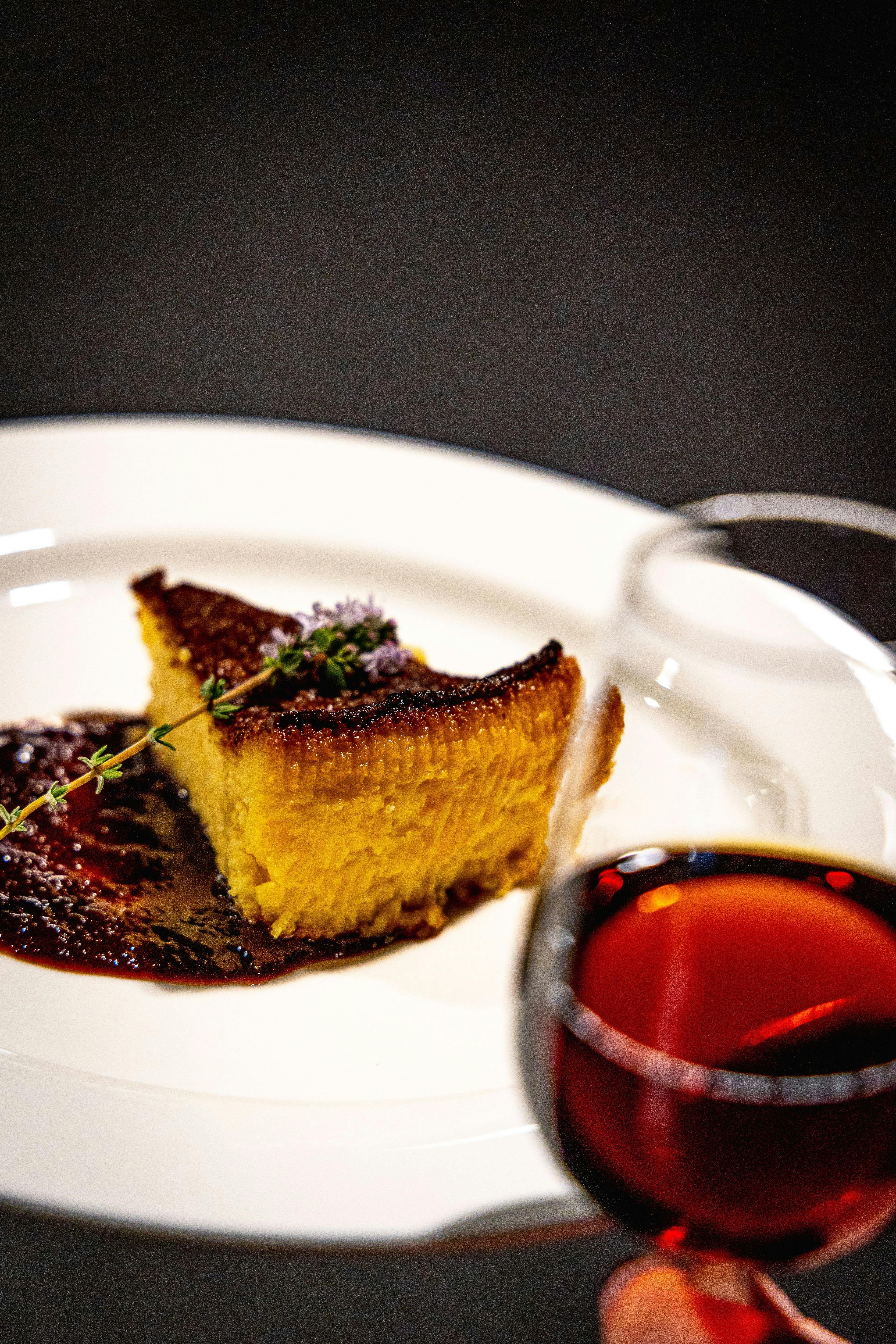 Dessert served on a plate and wine
