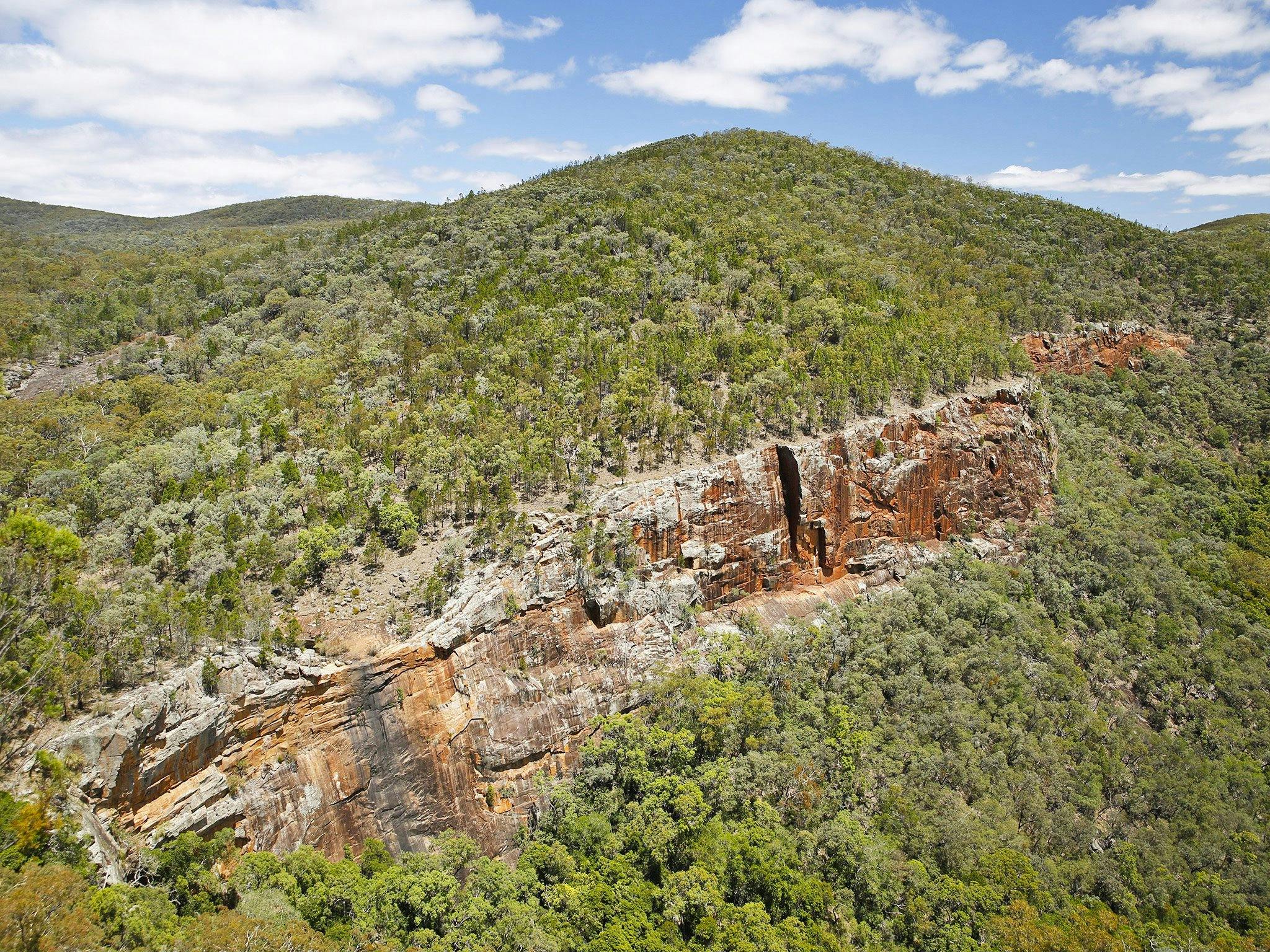 View of gorge and red, treeless cliff faces. View of gorge and red, treeless cliff faces.
