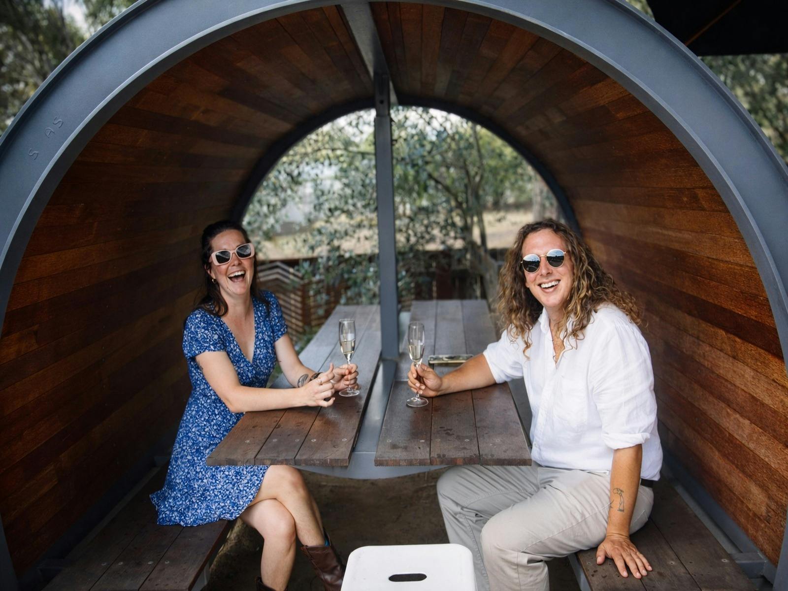 Two people enjoying wine