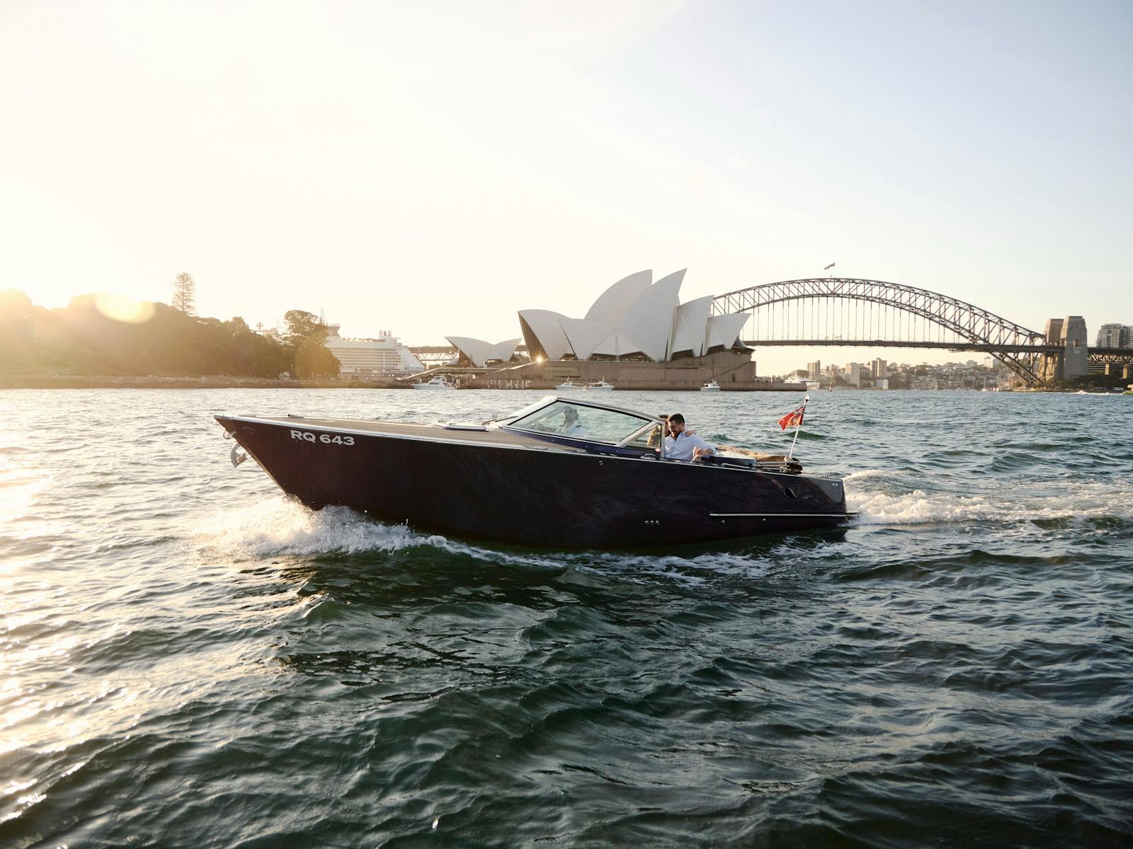 Private boat tour on MV Aquamajestic cruising Sydney Harbour with city skyline views.