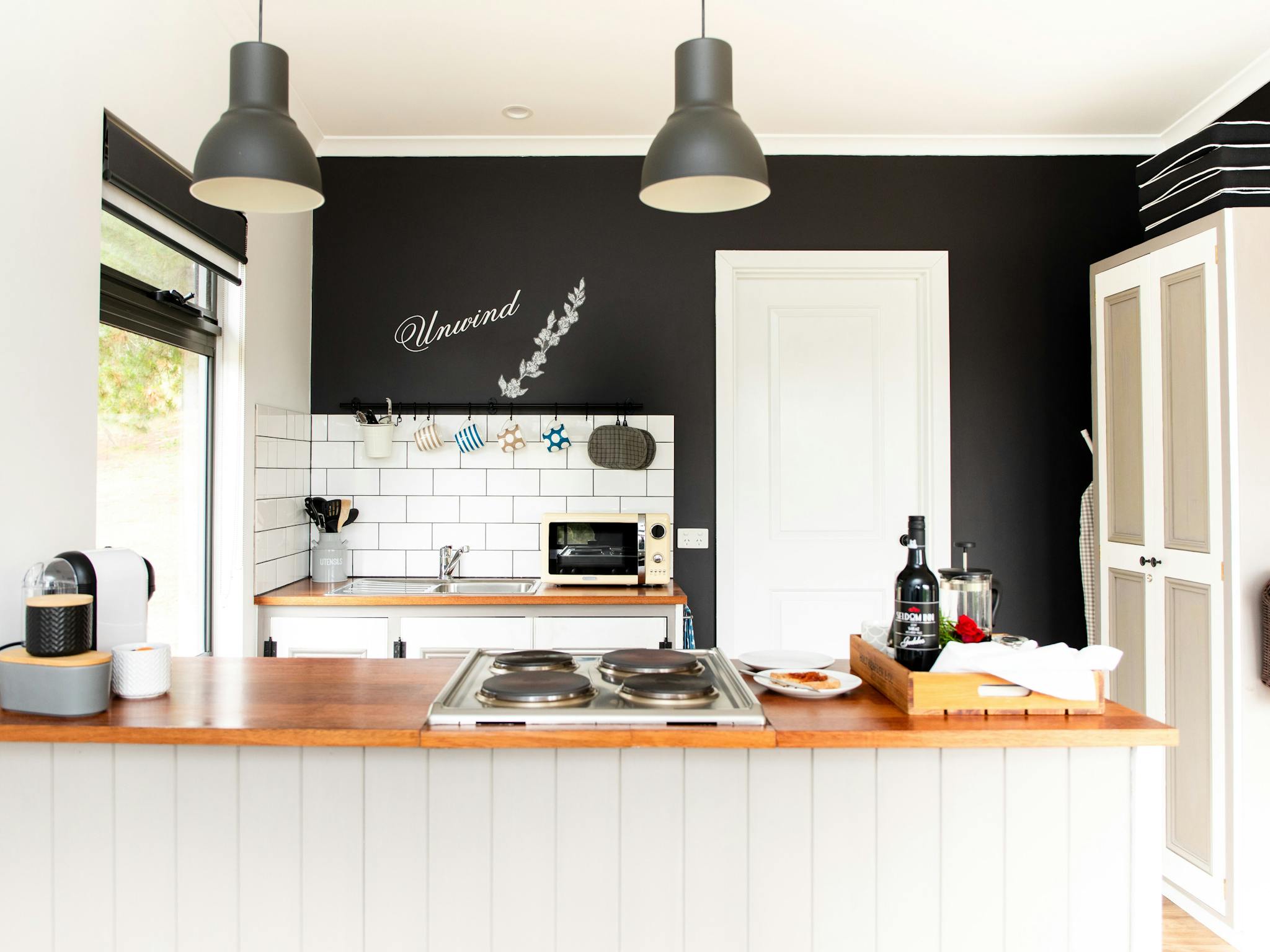 View of kitchen of The Unwind at Karawatha Cottages