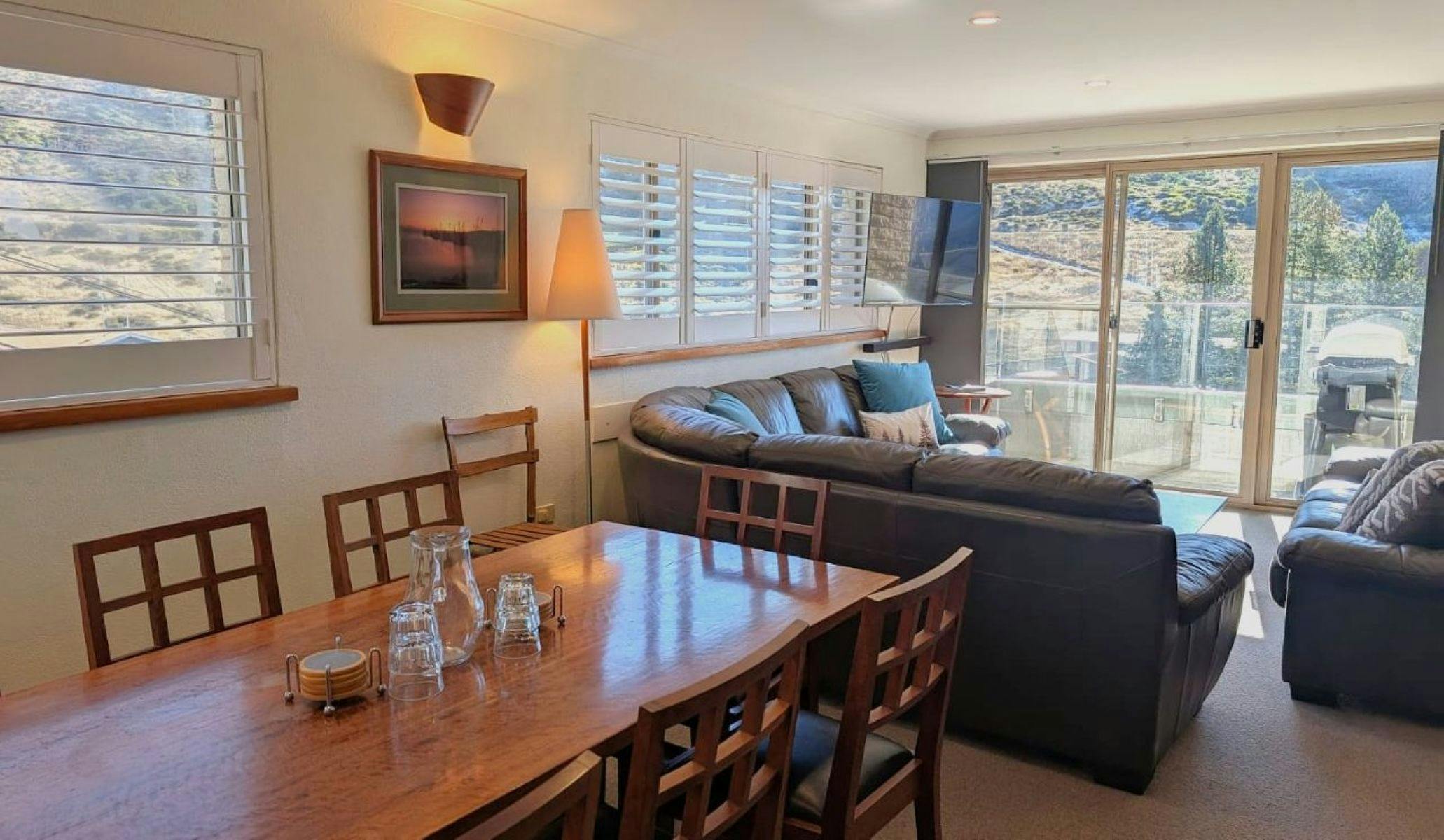 Living room with couch, table and chairs