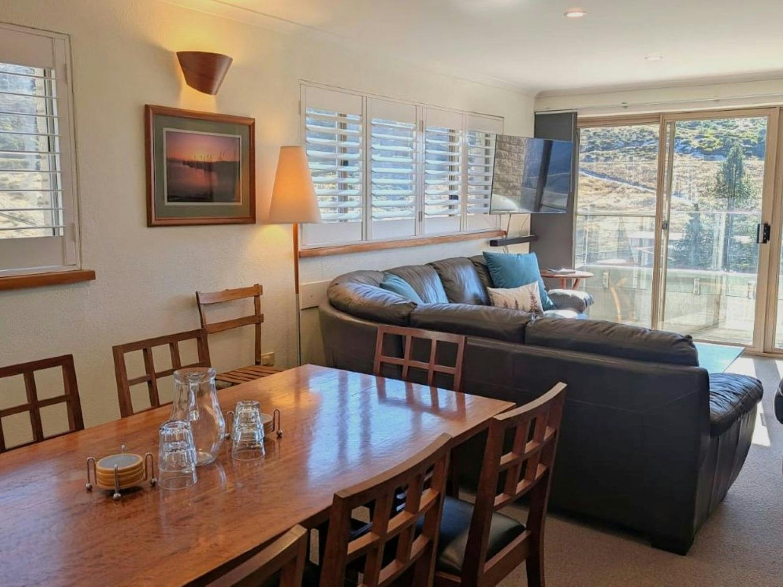 Living room with couch, table and chairs