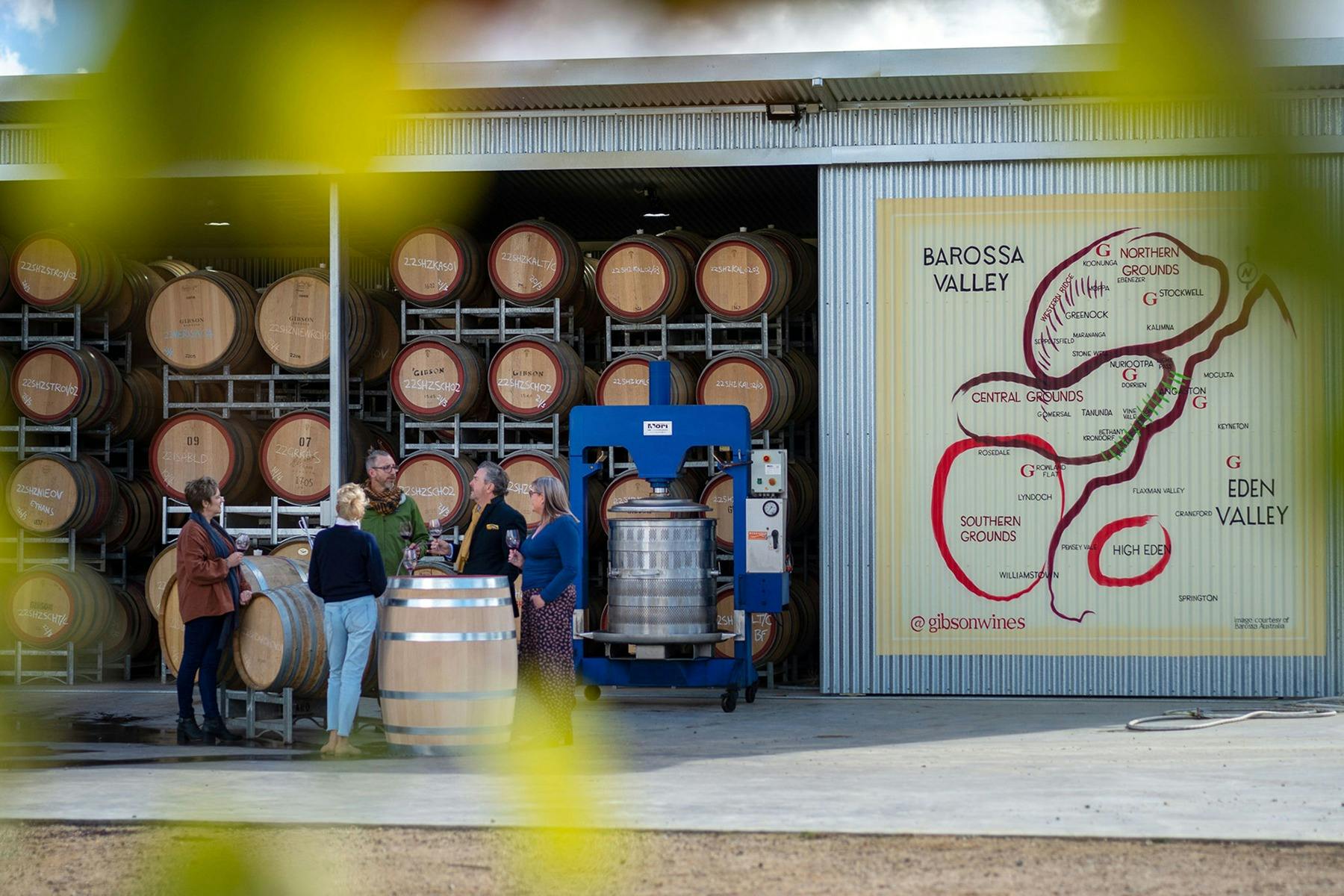 Gibson Winery doors open with barrels and basket presses
