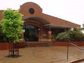The facade of the front of the Millicent Library with the Art Gallery to the right behind library.