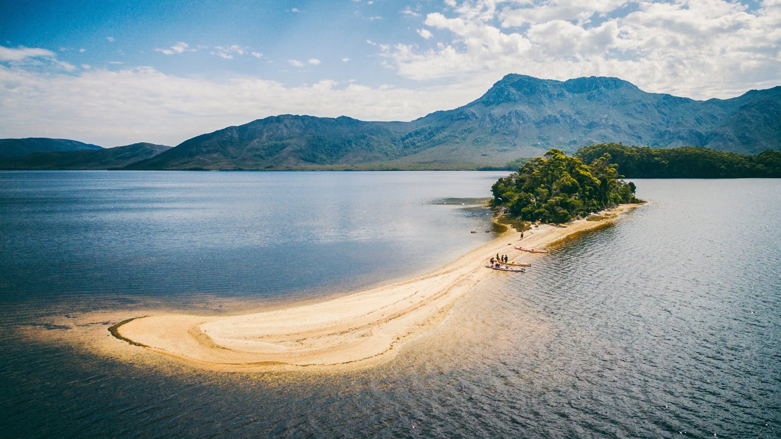 Kayakers on Black Swan Island on Bathurst Harbour, Southwest Tasmania