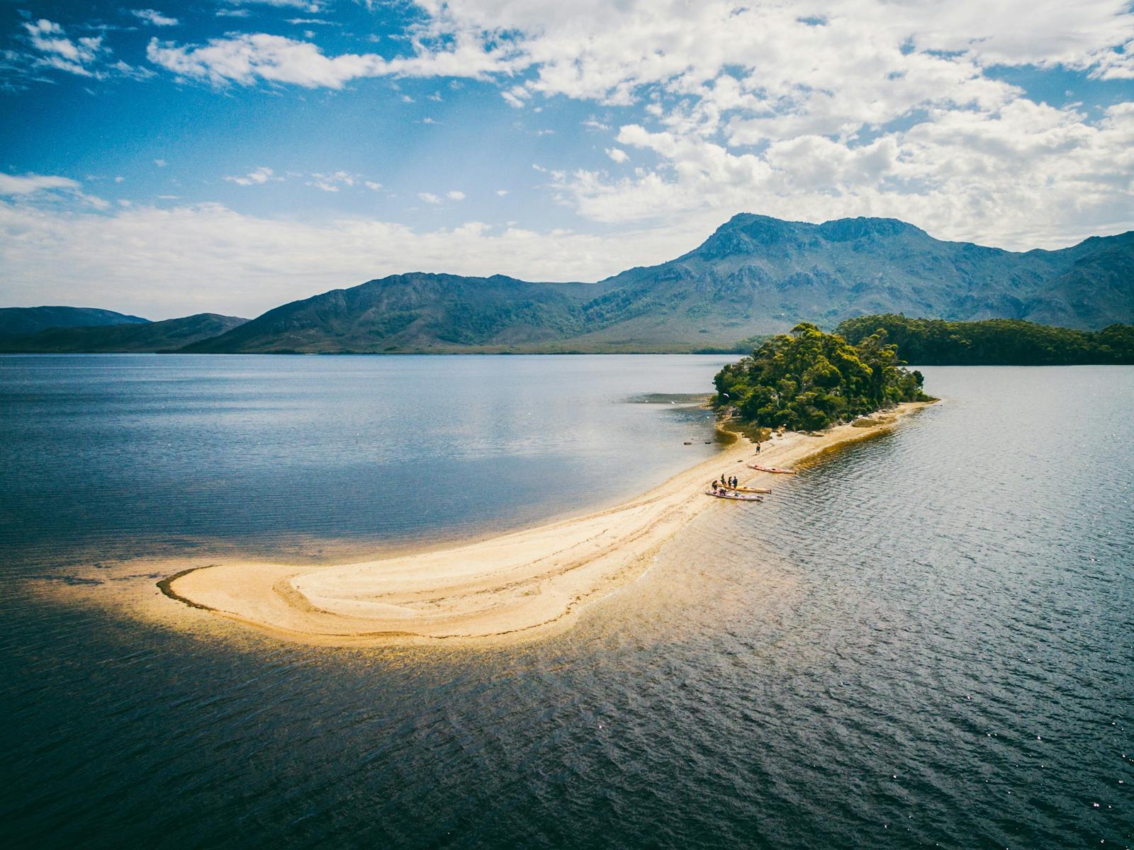 Kayakers on Black Swan Island on Bathurst Harbour, Southwest Tasmania