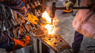 blacksmiths drifting a hammer head