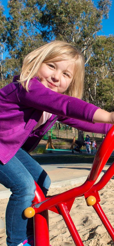 Girls playing in the sand at the Boundless Playground
