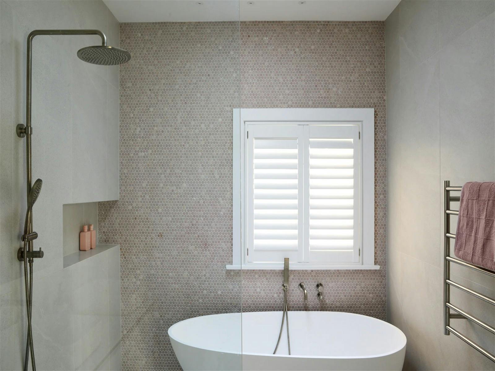 Simply unwind, relax and soak up in this luxurious bathroom featuring a bathtub