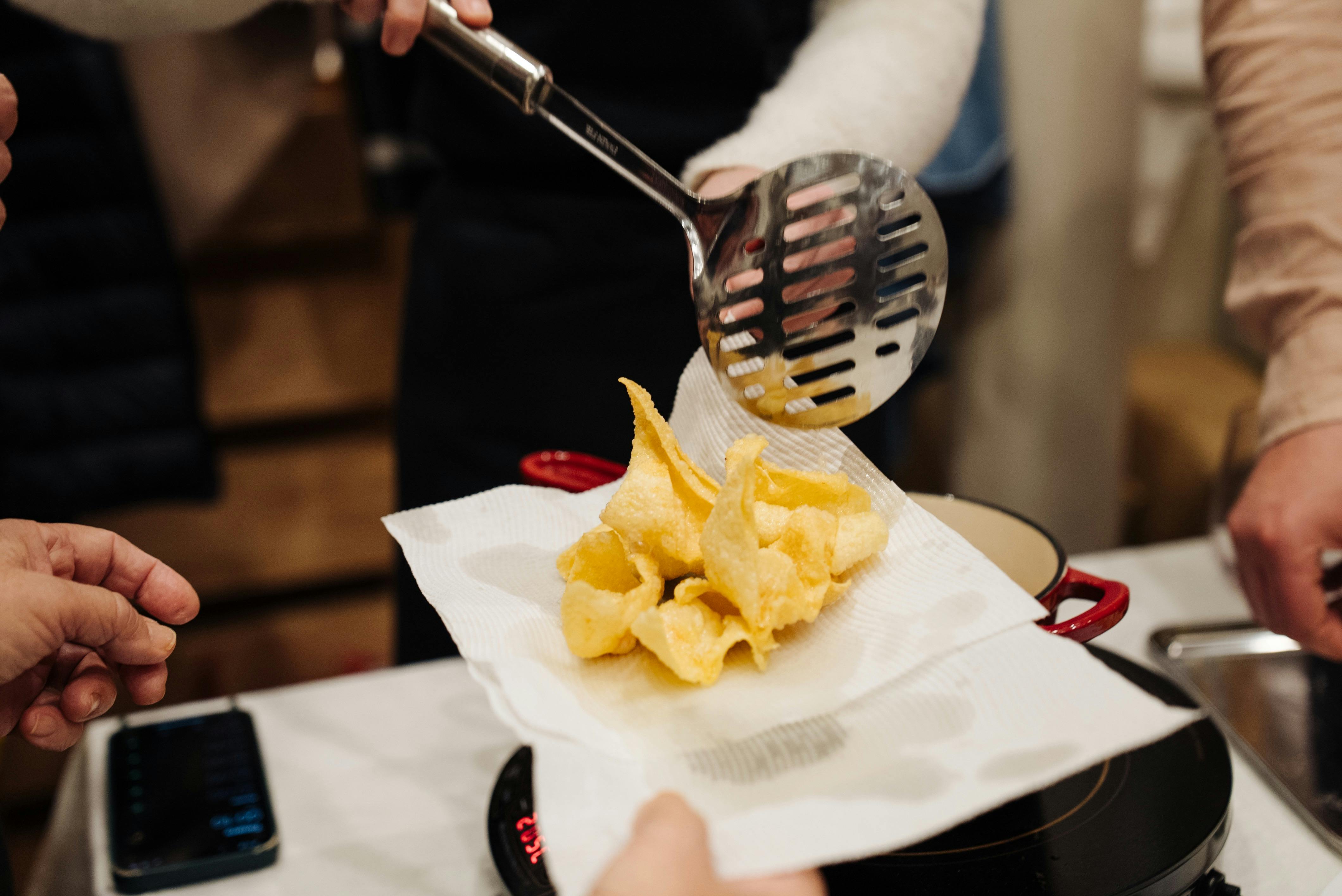 Fried Prawn Dumplings being scooped out of the hot oil
