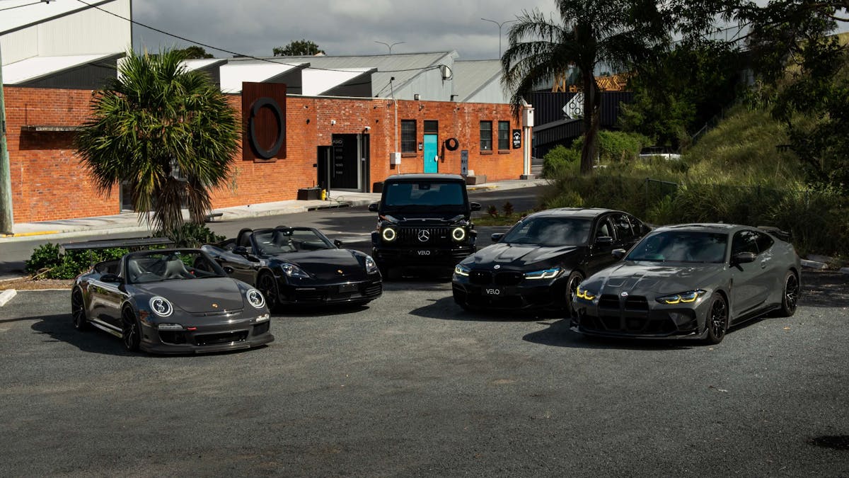 Velo Rentals luxury and exotic car fleet parked outside Brisbane headquarters