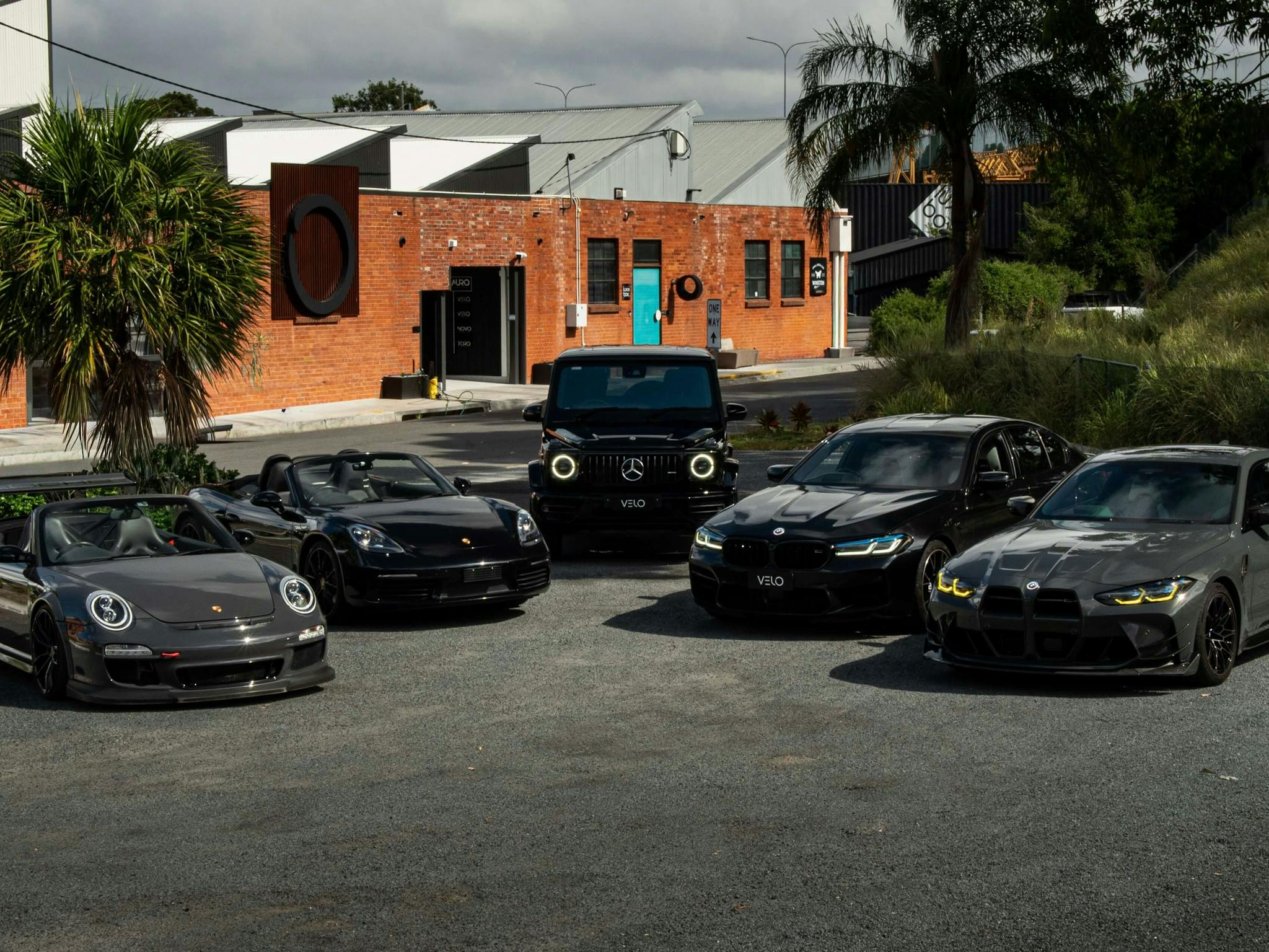 Velo Rentals luxury and exotic car fleet parked outside Brisbane headquarters Velo Rentals luxury and exotic car fleet parked outside Brisbane headquarters