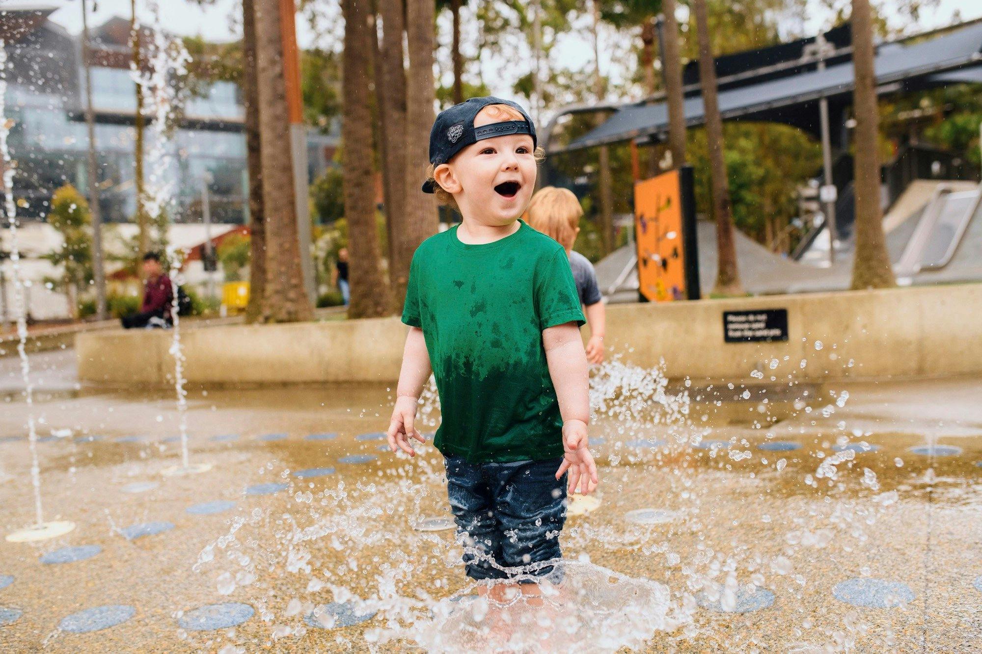 Young boy having a fun day out at The Playground, Darling Quarter