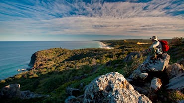 Walker sitting on Double Island Point, Cooloola Coast