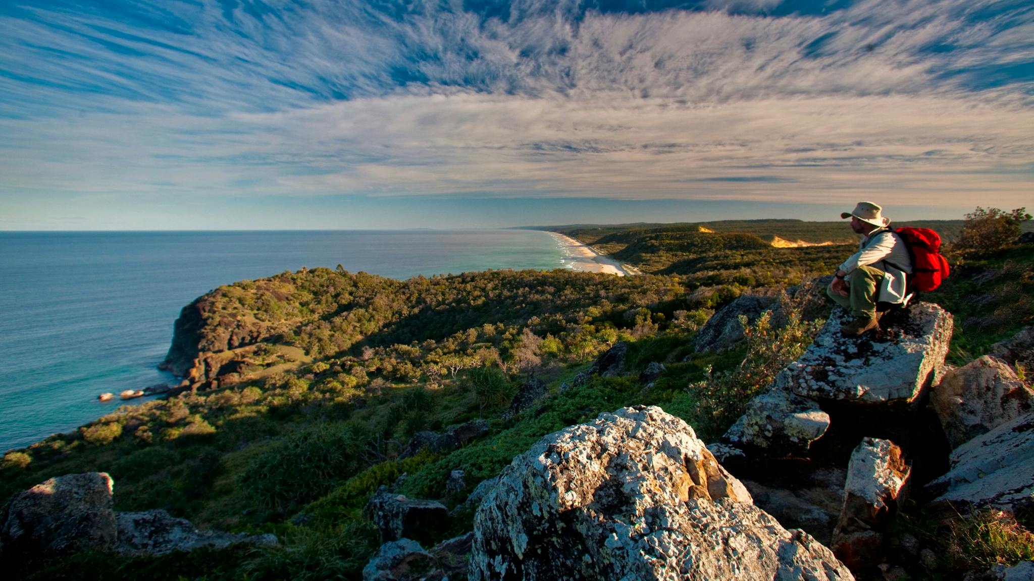 Walker sitting on Double Island Point, Cooloola Coast Walker sitting on Double Island Point, Cooloola Coast