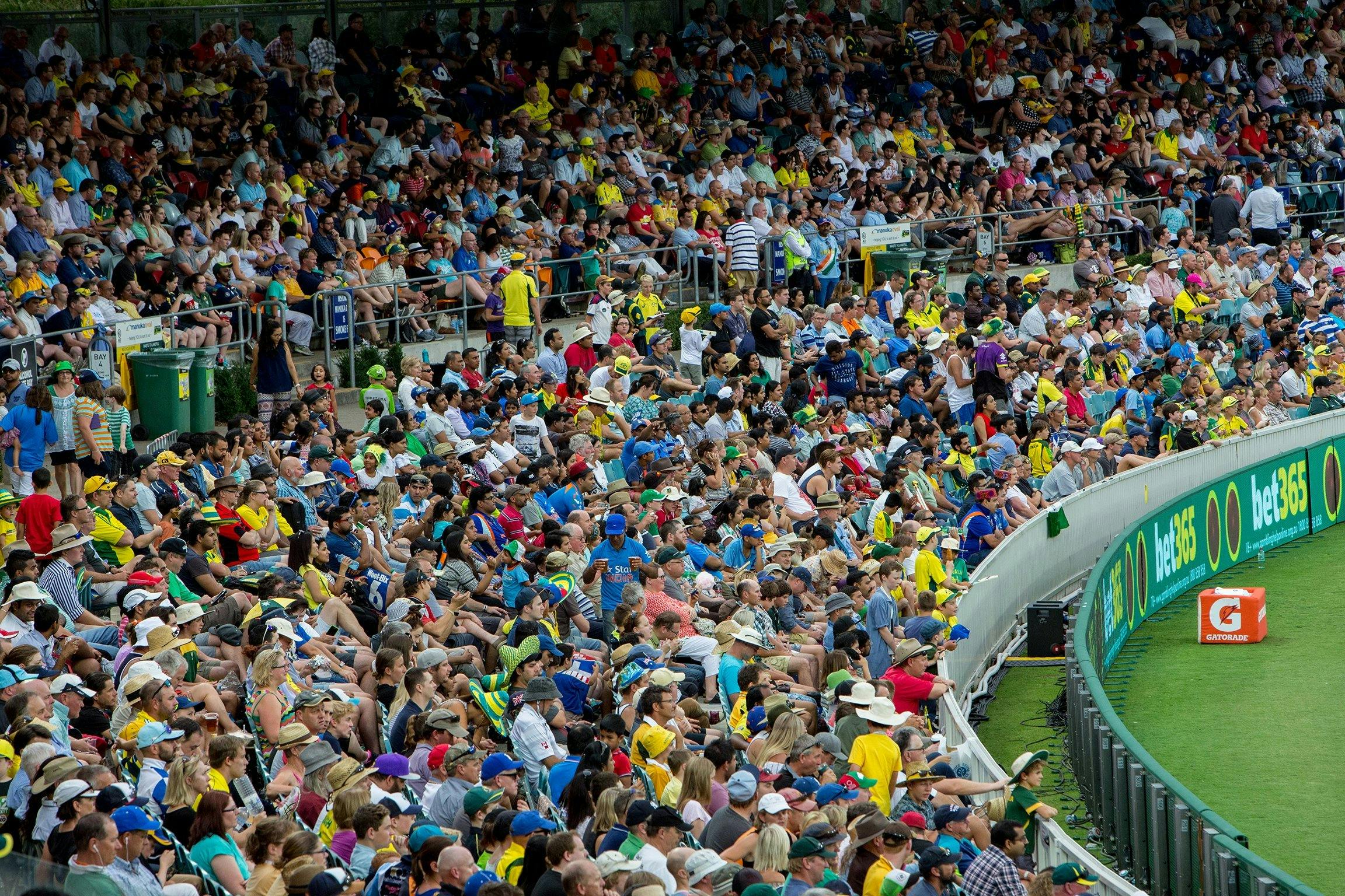 Full cricket stands during a day match
