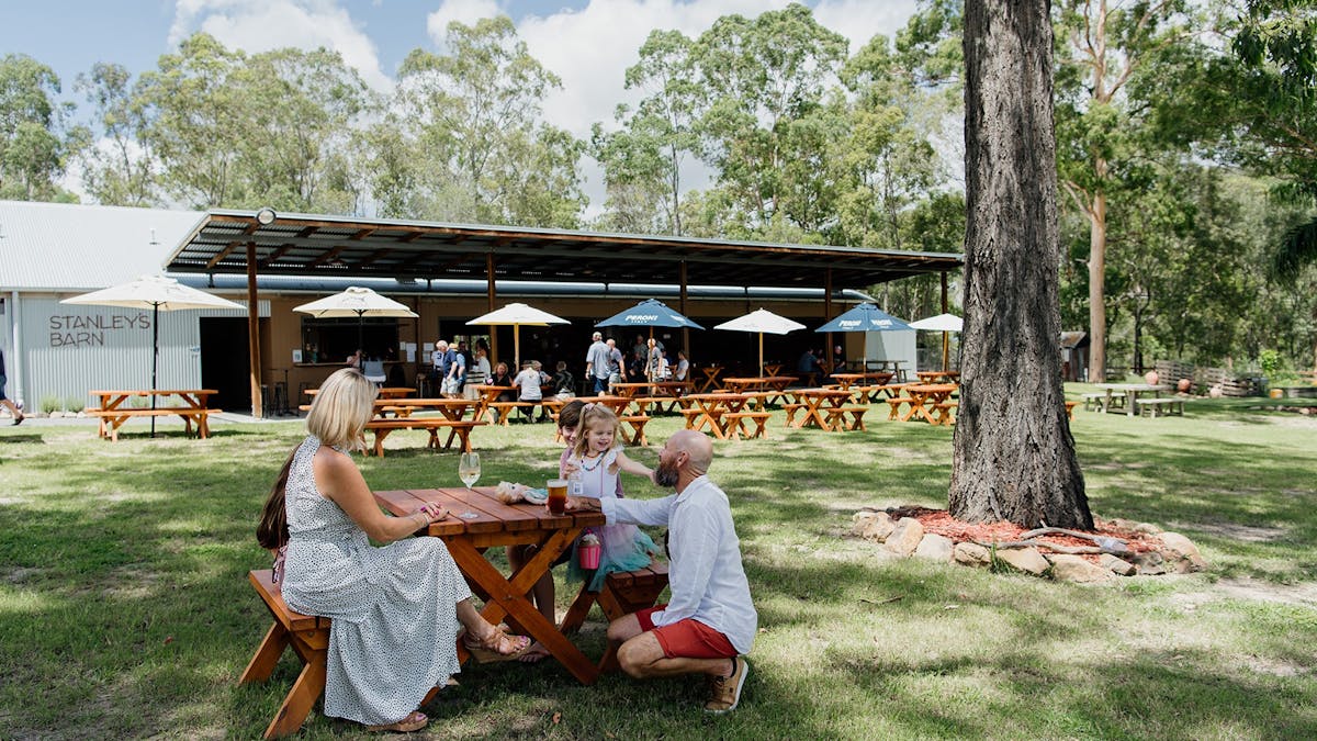 Family enjoying a beverage at Stanleys Barn