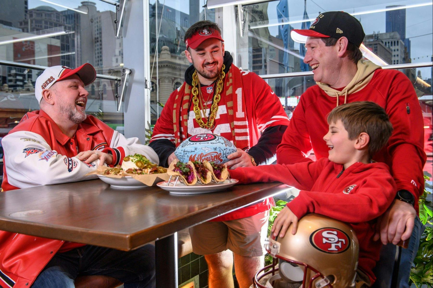 Fans dressed in red eating food dishes