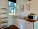 Fully equipped kitchenette, bar fridge, bbq, stove top, microwave kettle, toaster & utensils