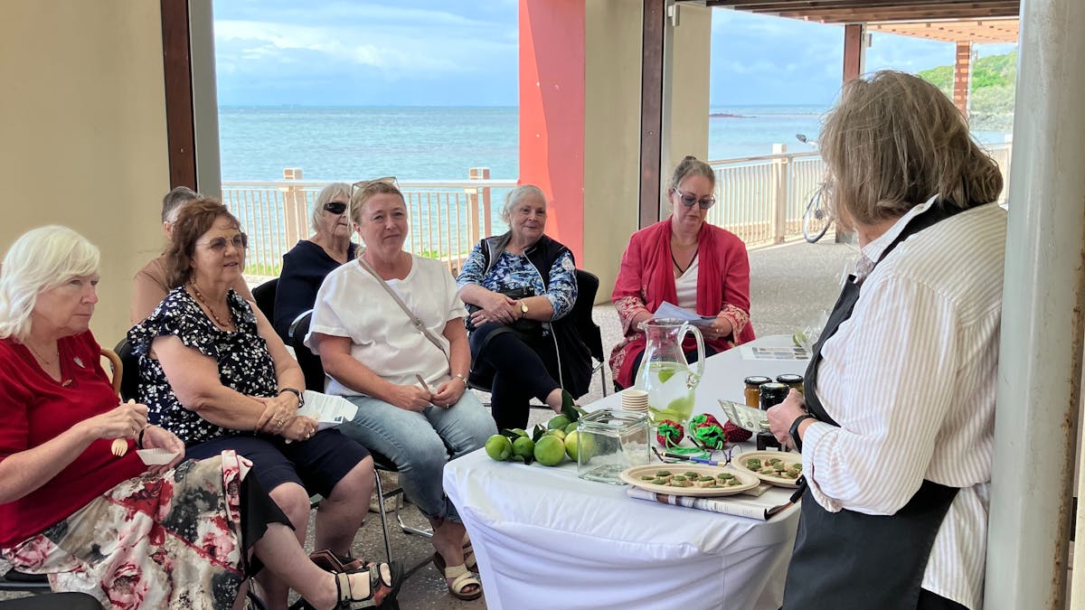Mini Tasting Event with Audience and Oceanview in the background
