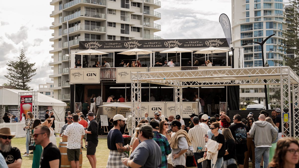 A two storey at the festival with a crowd in front