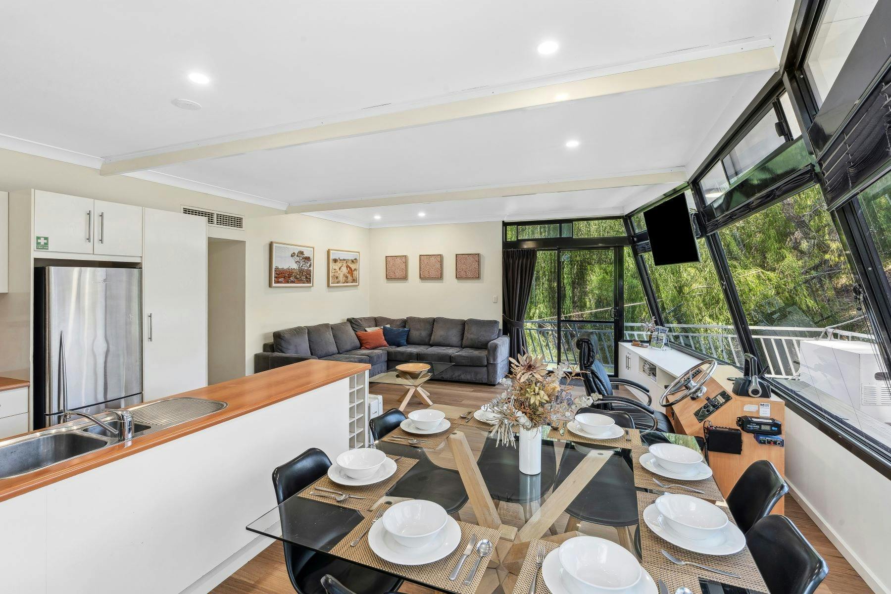 Spacious kitchen, living and dining area with 8 person dining table