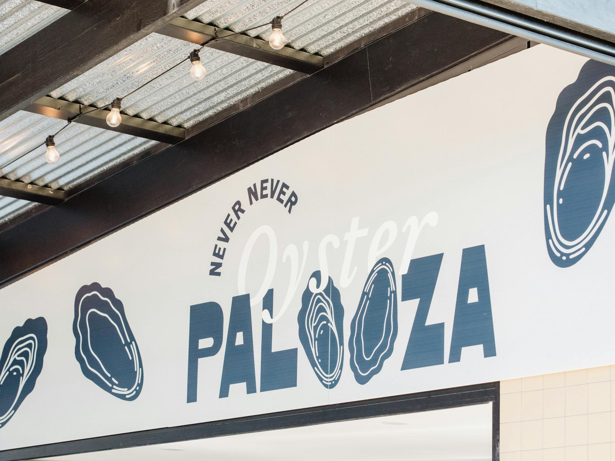 The Oyster Palooza sign at Never Never Distilling Co.