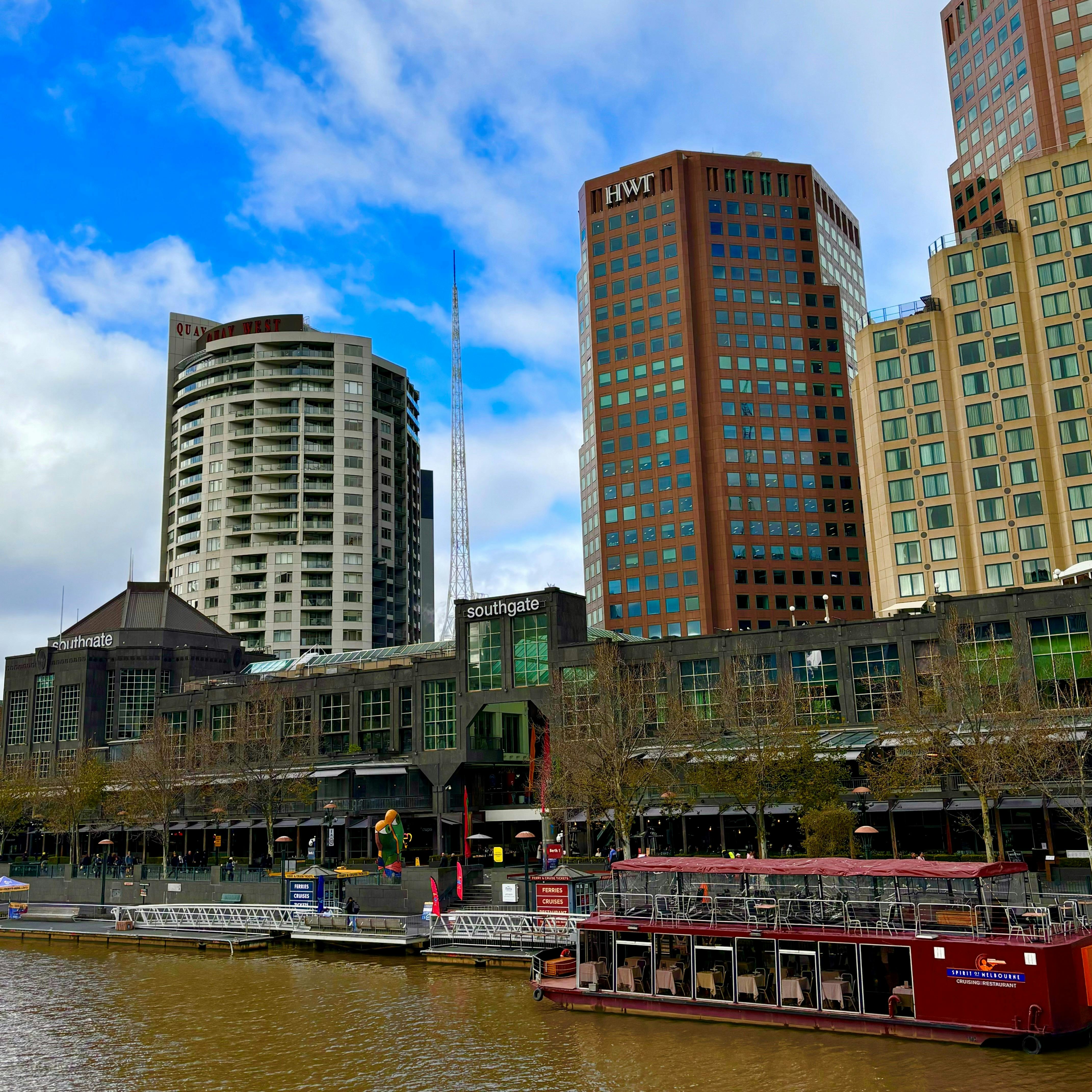 Image of Southgate, with the Yarra River. Buildings in background inclide HWT Tower & Langham Hotel