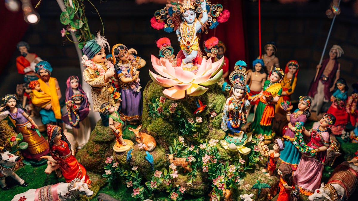 A photo of an intricate diorama of Krishna's pastimes