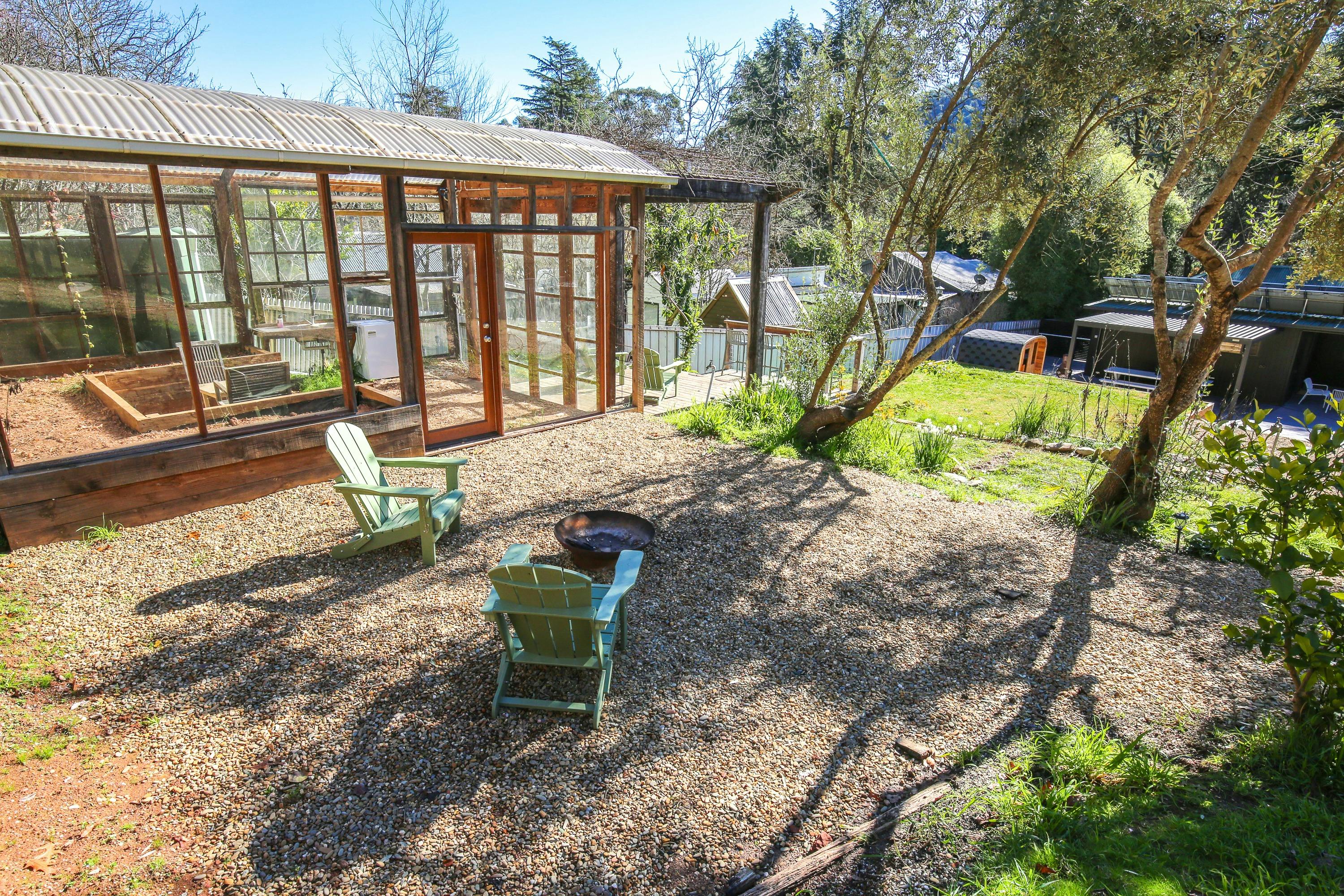 Back yard with terraces, seating area, fire pit