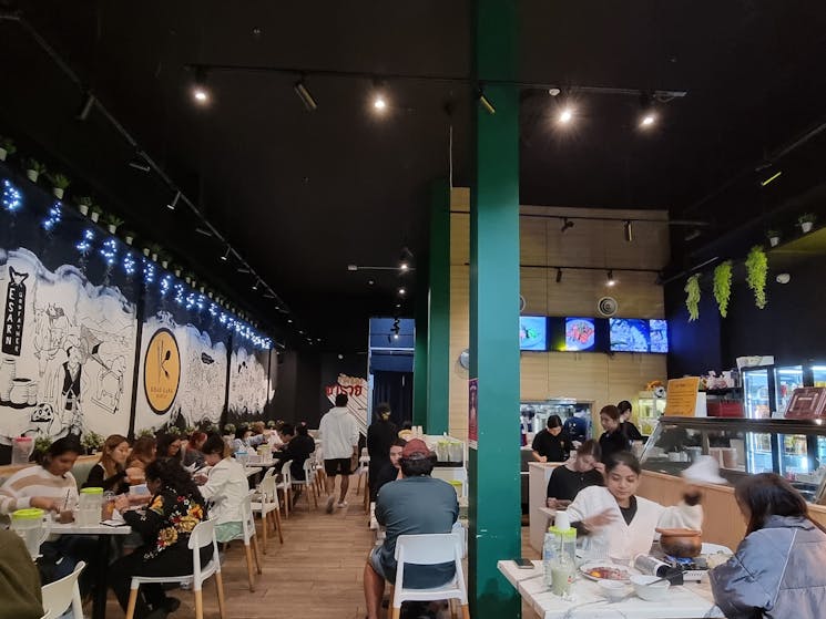 Restaurant interior with customers enjoying a meal